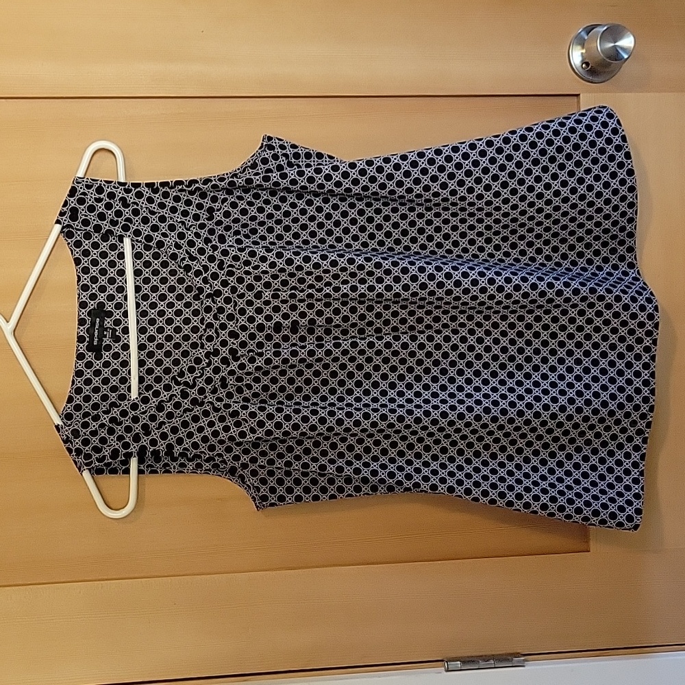 Women's black and white sleeveless blouse